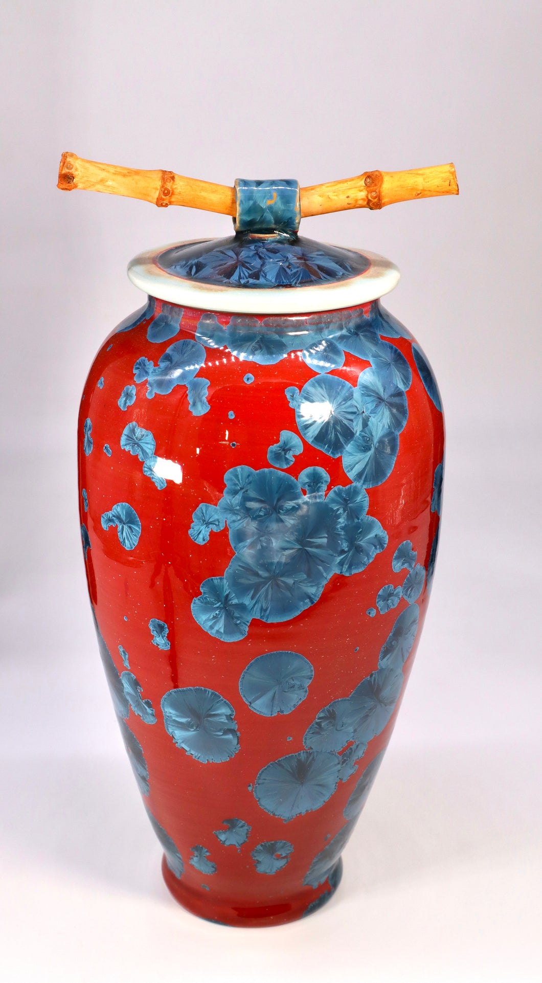 Red Jar With Blue Crystals.